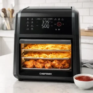 Chefman Air Fryer Oven sitting on a kitchen counter with crispy french fries inside